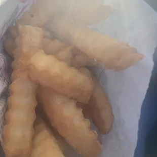 a basket of deep fried french fries