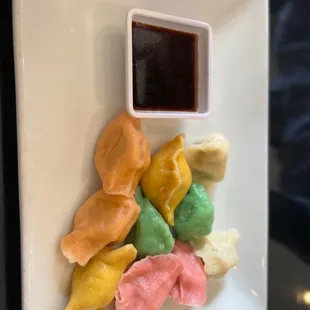 Assorted steamed dumplings. Each color a different one.