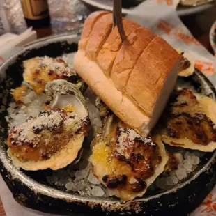 a plate of oysters and a sandwich