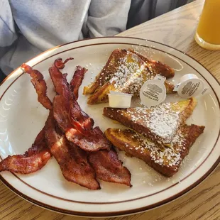 Half order of French toast with a side of bacon