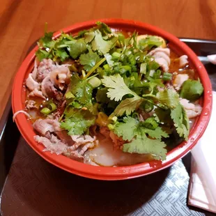 a bowl of soup on a tray