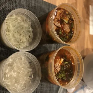 three cups of soup and noodles