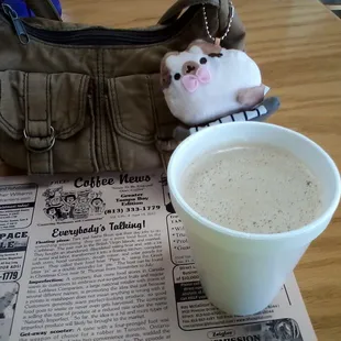 Creamy Café con Leche enjoyed with Coffee News and Pusheen.