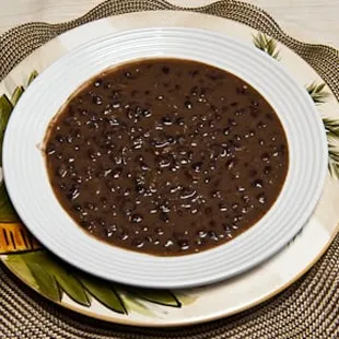 a bowl of black beans on a plate