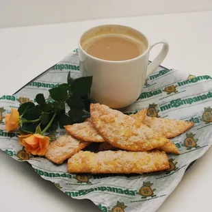 a plate of food and a cup of coffee