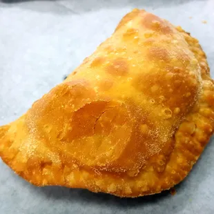 Picadillo empanada. Hot from the fryer and ready to be doused with hot sauce.