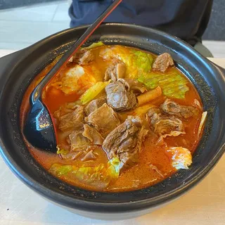 F3 Sliced beef with spicy chili broth