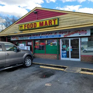 a truck parked in front of the store