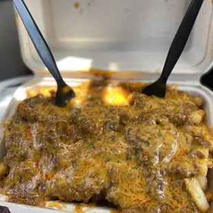 a close up of a meal in a styrofoam container