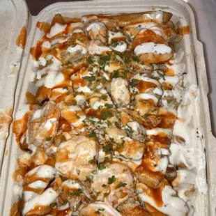 fries with shrimp , steak , chicken and buffalo