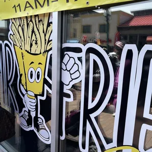 a sign on the window of a fast food restaurant