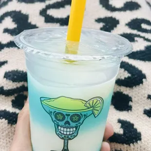 A "half-cup" of Mr. Snoop (like a Blue Hawaiian/Ocean water ) and Piña Colada with a shot of tequila, swirled perfectly together by Jess!