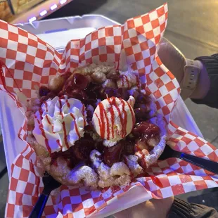 Strawberry delight with whipped cream and vanilla ice cream.