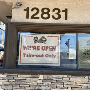 a sign in the window of a restaurant