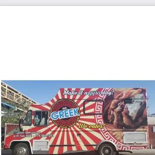 a food truck with an advertisement on the side