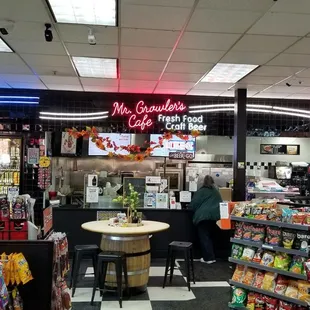 Nice seating area near the beer cooler and candy aisle.  Actually very nice for a gas station cafe.  Everything was clean and neat.