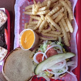 Cheese burger with a side of cheese fries