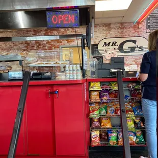 a woman standing at the counter