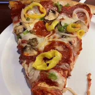 Slice of deluxe pizza