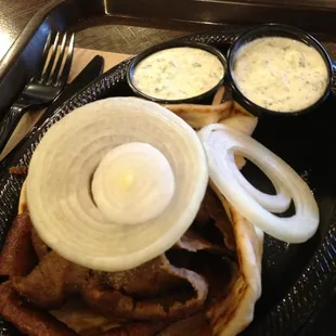 Gyro, extra meat, sauce, and onions. Hold the tomato.