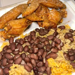 a plate of beans and fried chicken