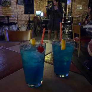 two cocktails on a table