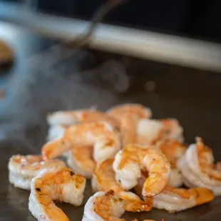 shrimp being cooked on a grill