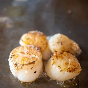 scallops cooking in a pan
