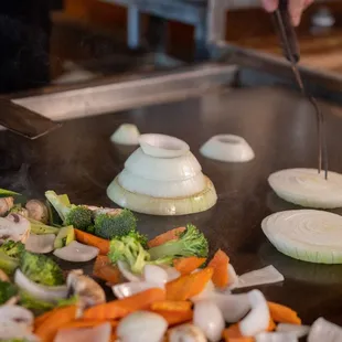 a chef cooking vegetables