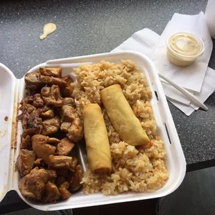 chicken teriyaki with fried rice and two spring rolls