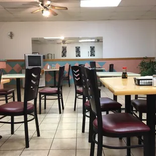a restaurant with tables and chairs