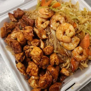 shrimp and rice in a styrofoam container