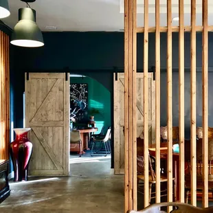 a living room with a wooden partition