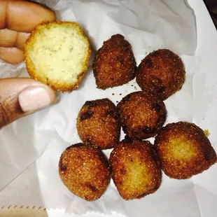 Hush puppies (think it&apos;s made out of cornmeal and onion)