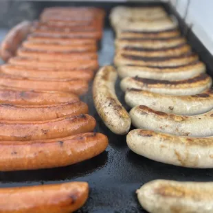 Delicious Brats cooked &amp; served in our Famous Delicious Beer Butter Onions