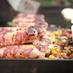 Bacon wrapped polish sausauge.