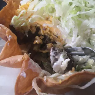 Under the heap of lettuce, way too much sour cream, drowned out the taste of everything else.