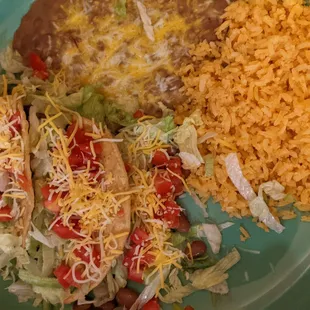 Three taco dinner with rice and beans, these substituted pintos as a protein for a tasty vegetarian-friendly plate.