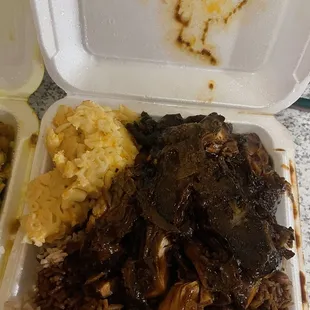 Jerk chicken, Mac and cheese, rice and peas.