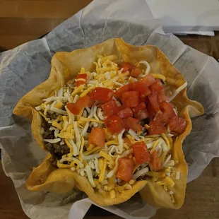 a taco in a paper bowl