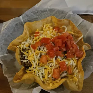 a taco in a paper bowl
