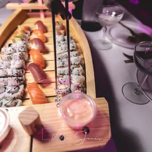 a row boat filled with sushi