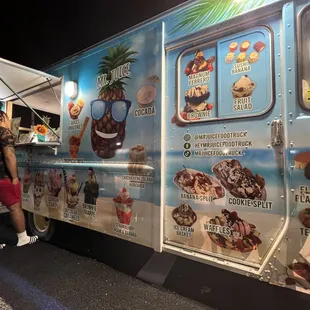 a man standing in front of a food truck
