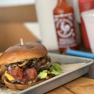 a burger and fries on a tray