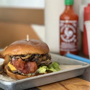 a burger and fries on a tray