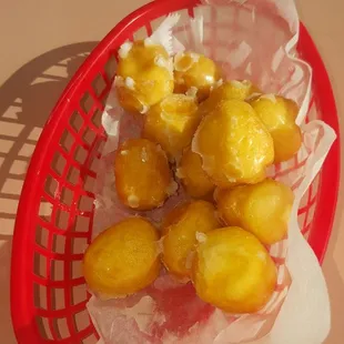 a basket of fried donuts