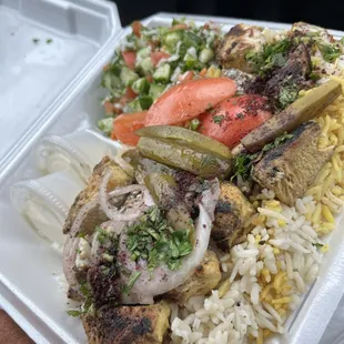 Skewer Platter with chicken, rice, and cucumber salad