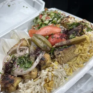 Skewer Platter with chicken, rice, and cucumber salad