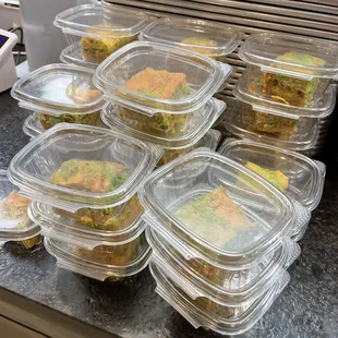 a stack of plastic food containers