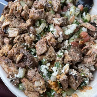My go to: Chicken Shawarma Bowl with tabbouli, cucumber mix, hummus, rice &amp; couscous, fattoush dressing